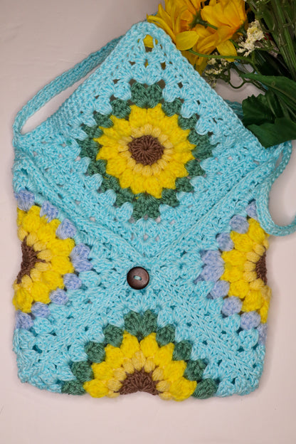 Crocheted bag with sunflower pattern on a light background